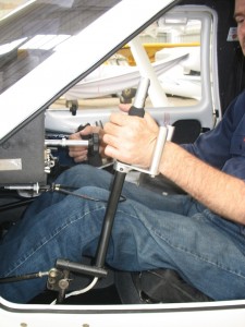 he rudder is controlled with his left hand by hand lever by pushing it forward or backwards. No foot control is required for the rudder which is used to keep the aircraft flying straight.