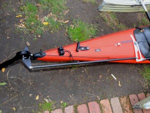 Rod runs along side the kayak to control the rudder.